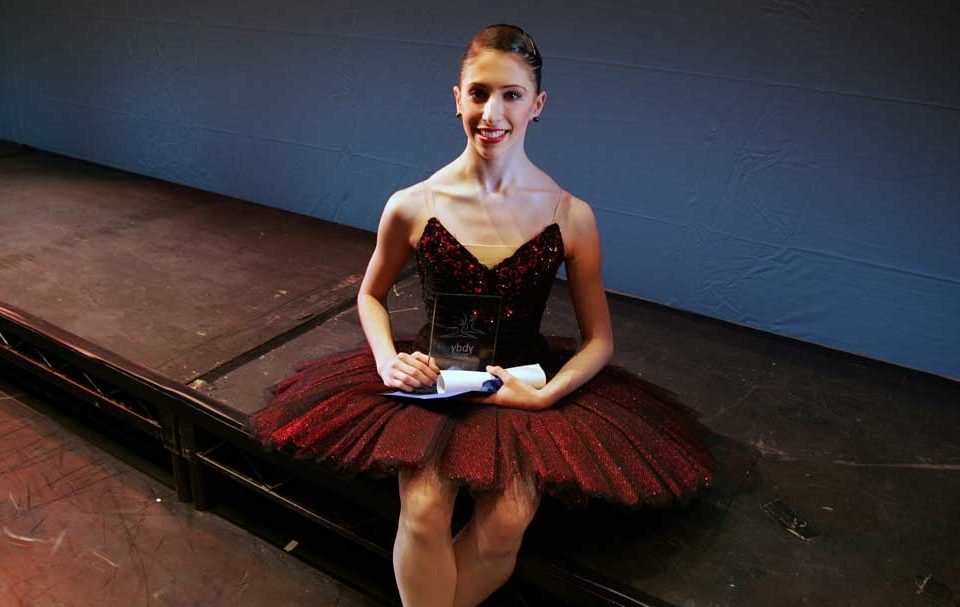 Yasmine naghdi sat with her 2009 british young dancer of the year award.