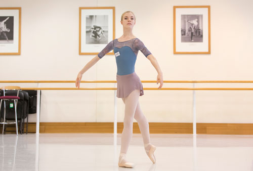 Girl stood, ready to dance, in the middle of a studio at Upper School