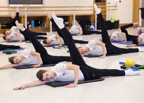 Students doing Pilates in a studio