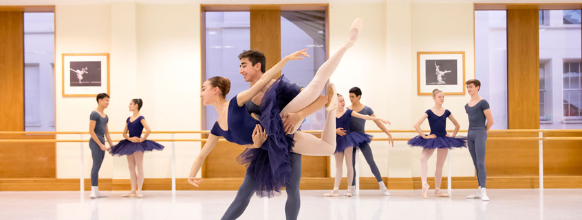 Students practicing in pas de deux class Students practicing in pas de deux class