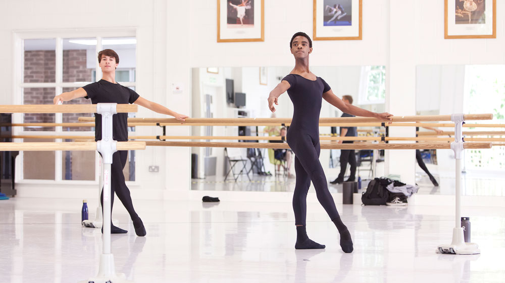 Two students dance in the studio as part of an online intensive course