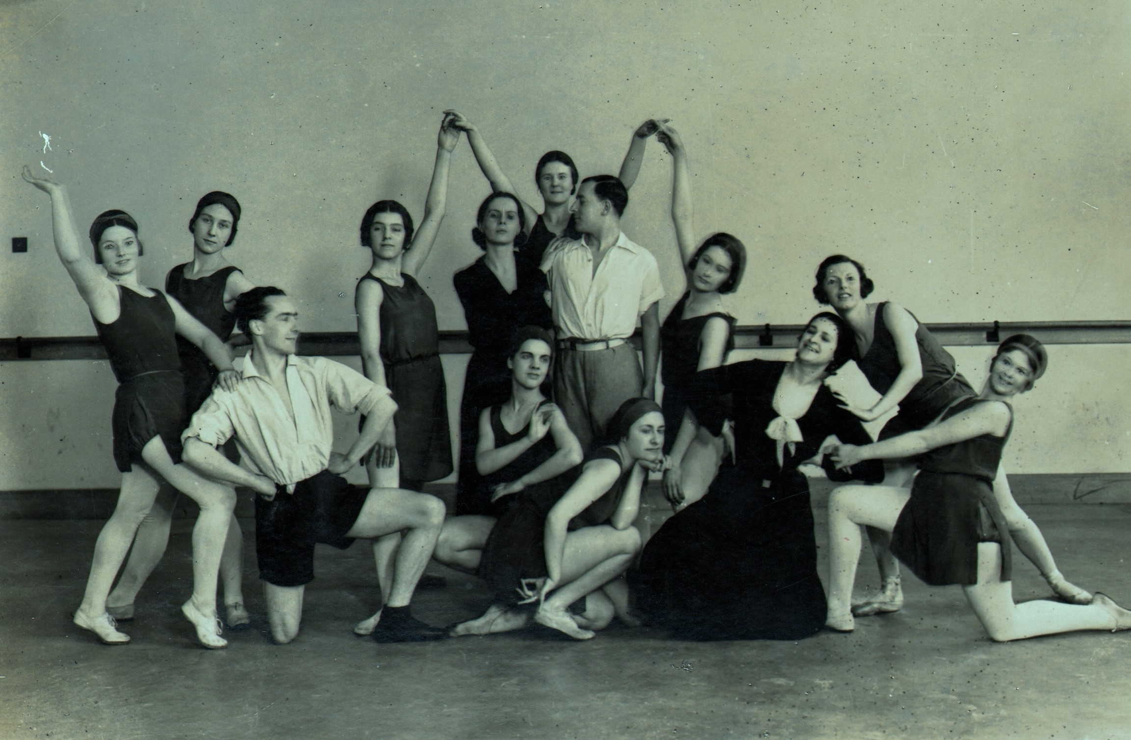 Ninette de valois (standing centre) and ursula moreton (kneeling in dress) with students of the vic-wells school just after it became resident at sadler’s wells theatre in 1931.