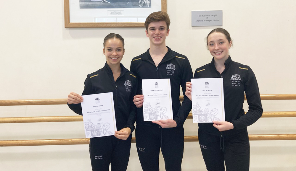 Students holding certificates