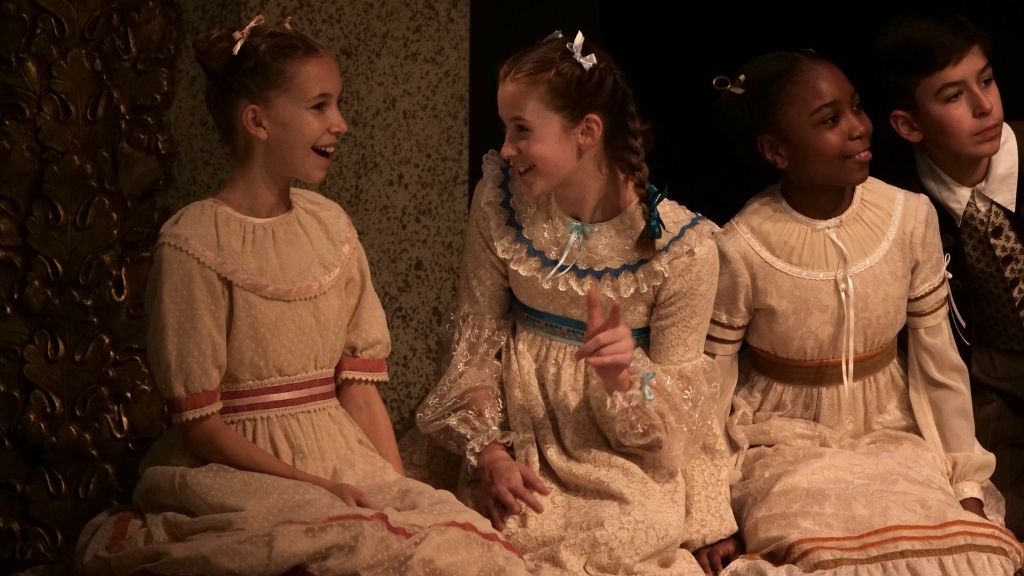 Young dancers dance in a circle in a production of the nutcracker