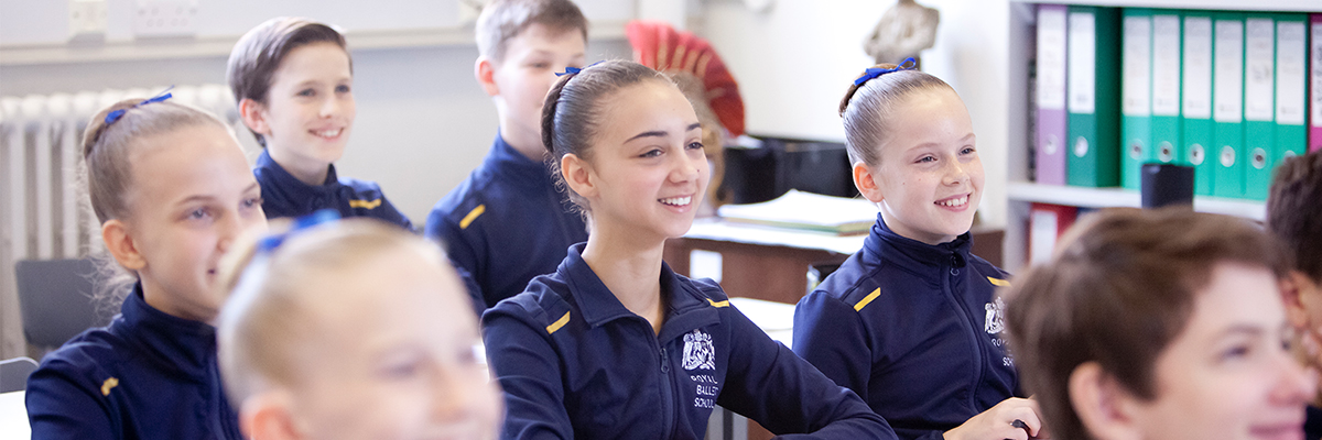 Students smiling in classroom