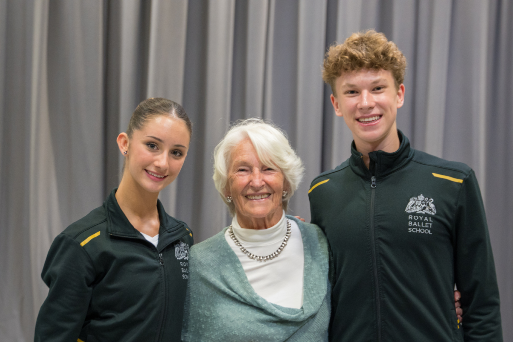 Lady sainsbury with two upper school students