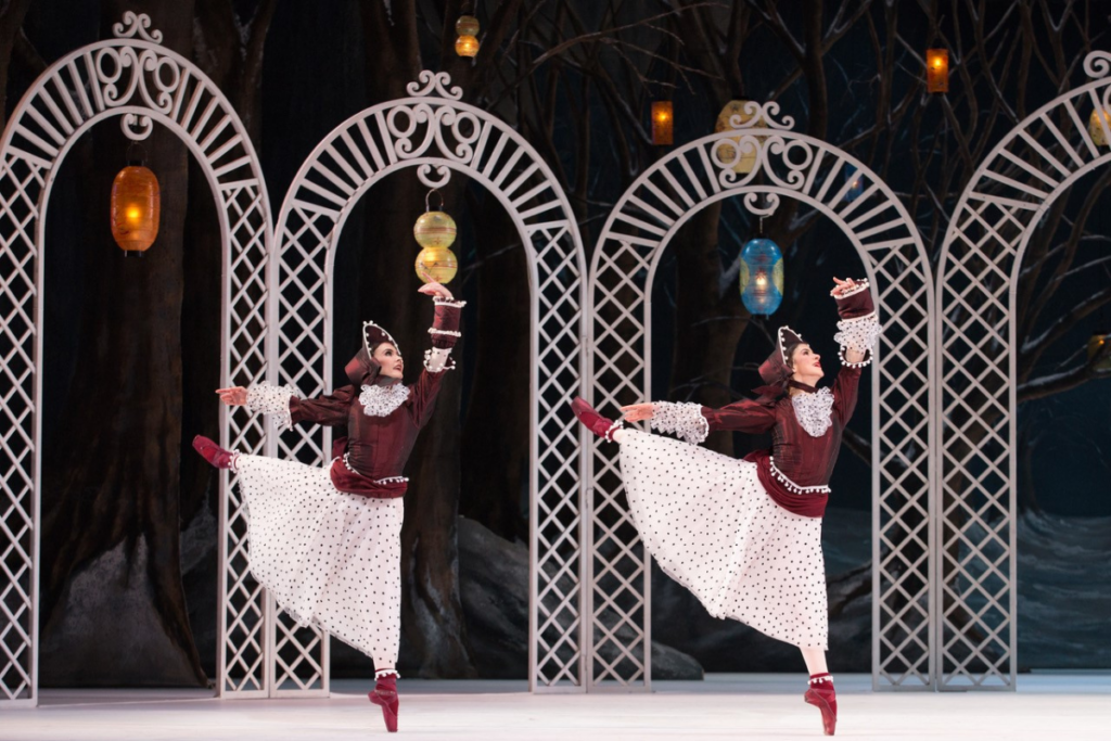 Two female dancers performing an arabesque in frederick ashton's les patineurs