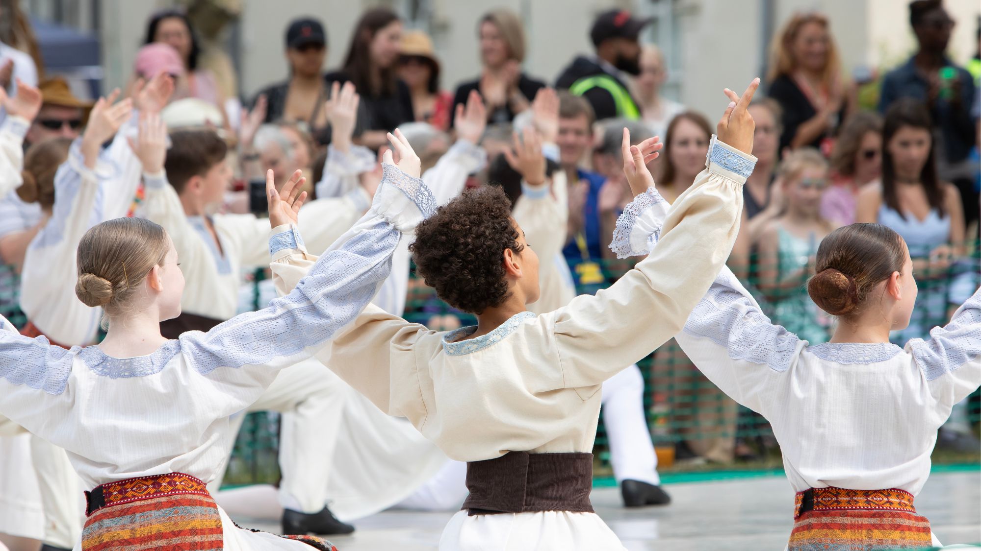 Students dancing at the summer fair