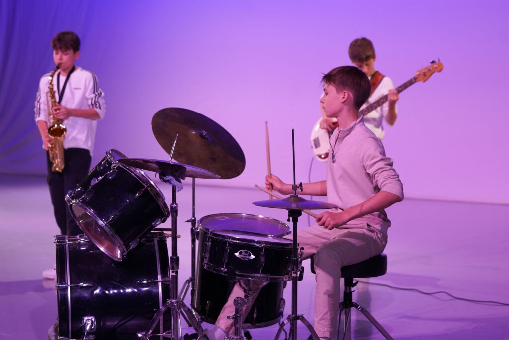 Students in a band performing for the arts showcase
