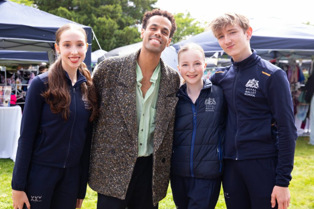 Three royal ballet school students smiling with joseph sissens
