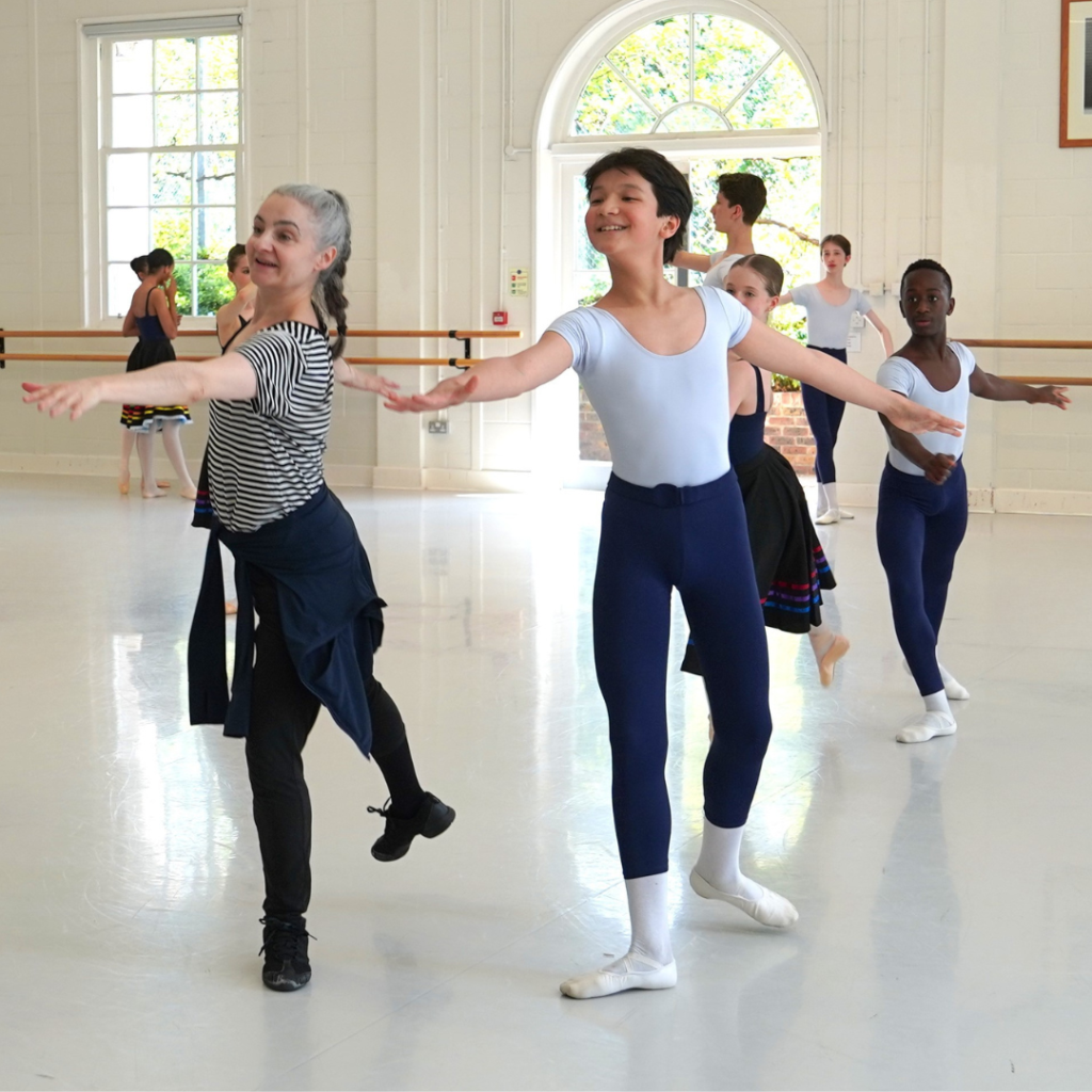 Summer performance spotlight: diana cuni mancini on the legacy of bournonville's napoli Diana and male student dancing together
