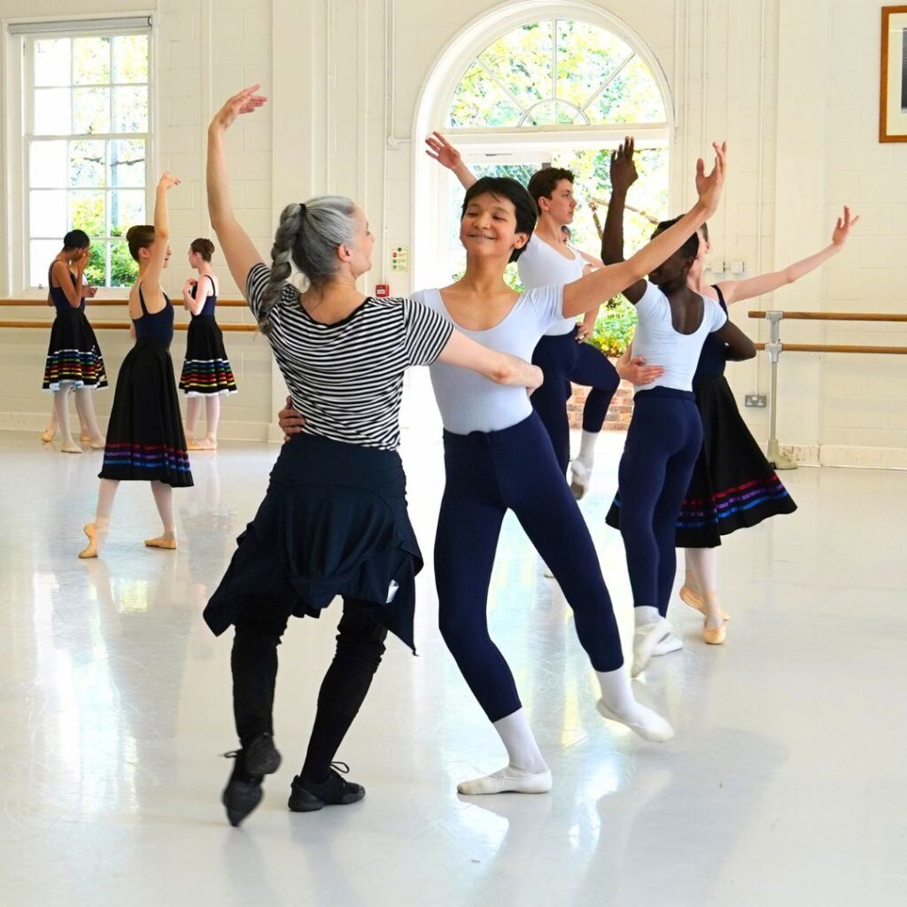 Summer performance spotlight: diana cuni mancini on the legacy of bournonville's napoli Diana and male student dancing together
