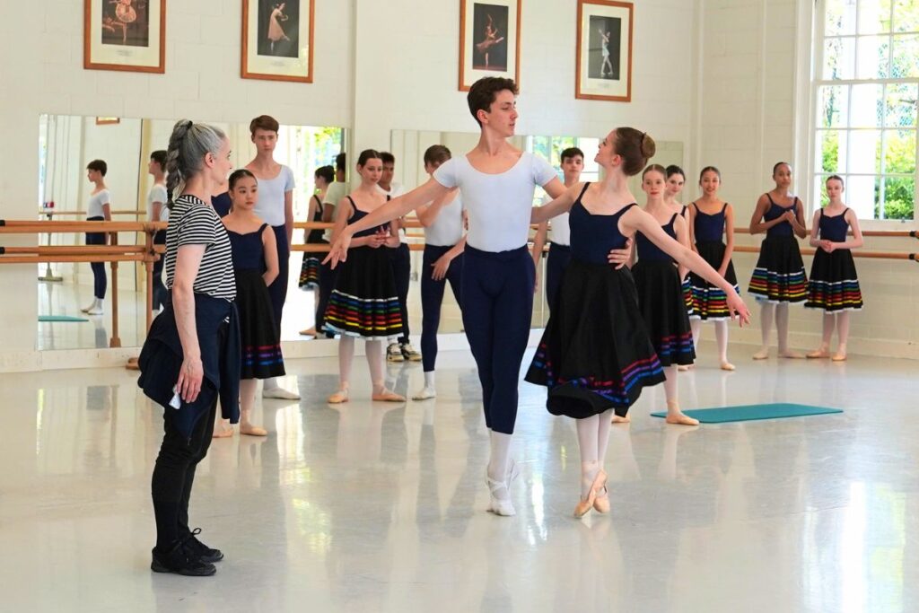 Two dancers, male and female, in each other arms about to begin to dance with diana cuni mancini
