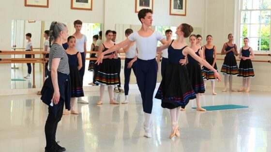 Two dancers, male and female, in each other arms about to begin to dance with diana cuni mancini