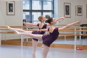 Two students at the royal ballet school in class.
