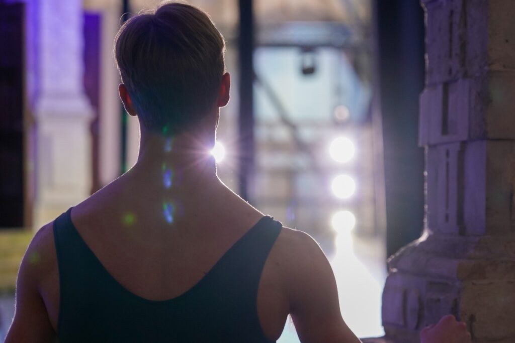 Celebrating world mental health day with our school counsellor and mental health lead Photo of the back of a student backstage silhouetted by light