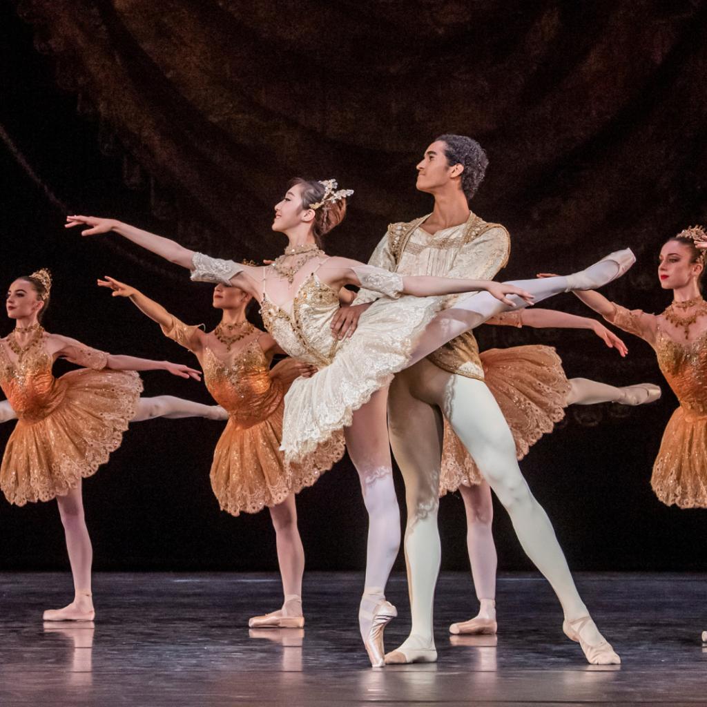 Davi in paquita wearing a gold and white costume.