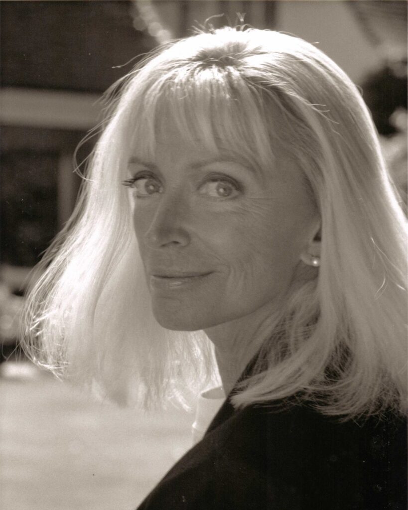 Three longtime supporters of the school share why they choose to leave a lasting legacy for our students April olrich in a black and white portrait. She smiles softly at the camera, looking over her left shoulder. Her white hair is in a bob with a fringe, lightly blown in the wind.