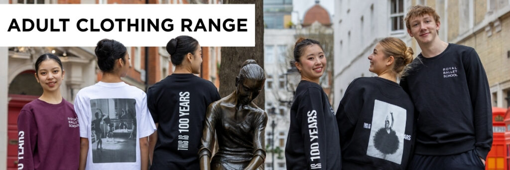 Six students stand around the ballerina statue in covent garden modeling the adult sweatshirts and t-shirts