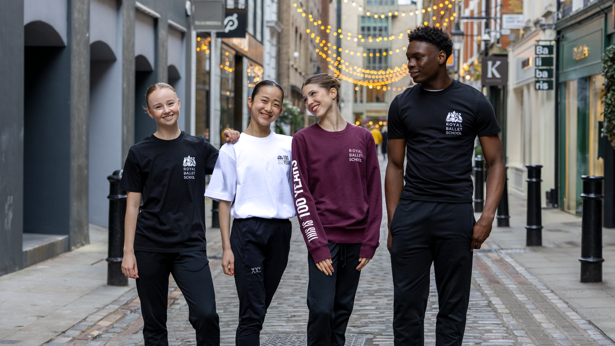 Students on floral street smiling in streetwear