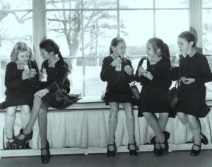 Lesley collier (centre) with fellow students at white lodge drinking milk