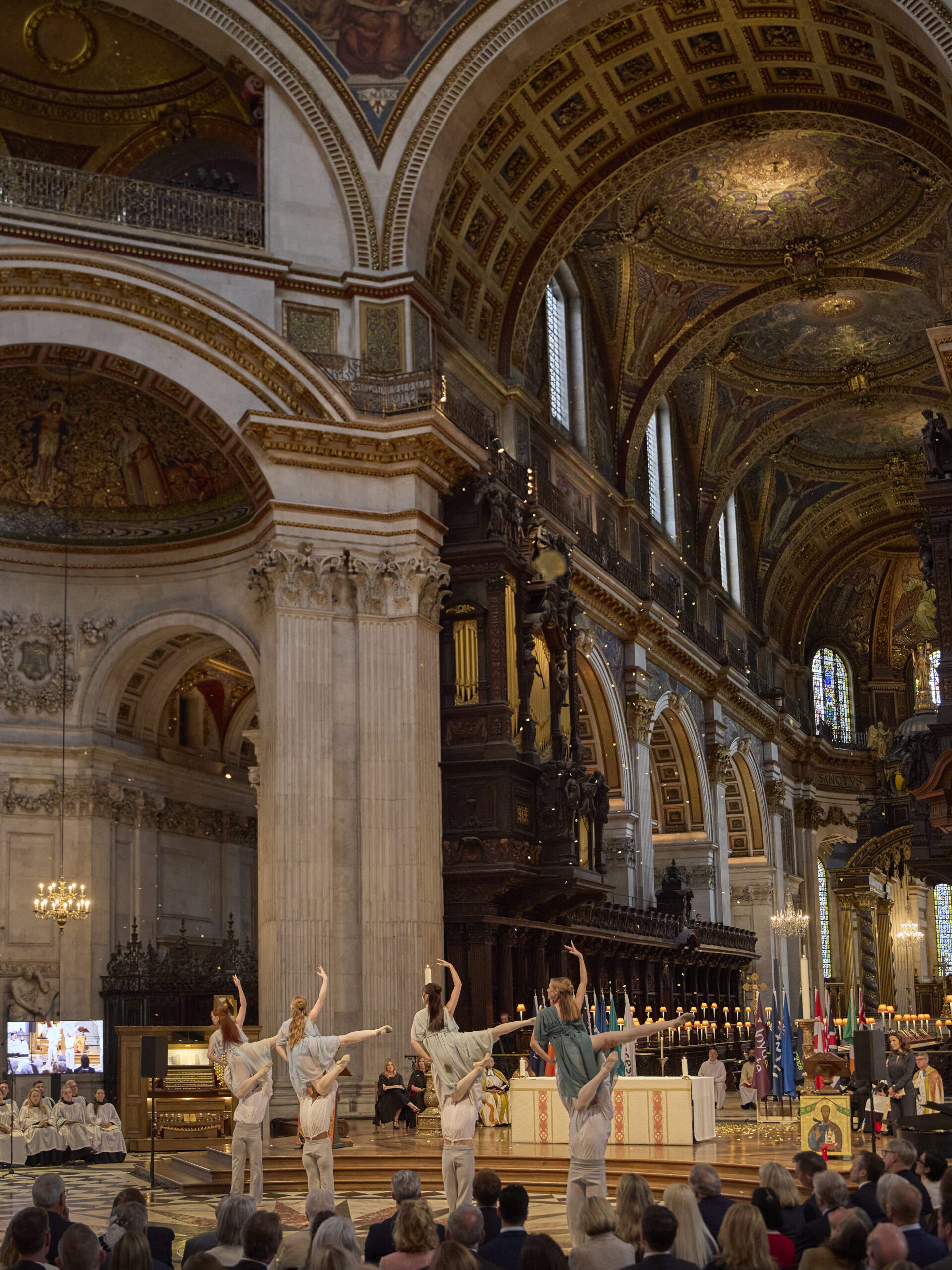 Student choreography shines at benefact group’s service of celebration at st paul's cathedral The men hold the ladies above their heads in an elegant lift under the dome in the cathedral as golden petals fall from the ceiling.