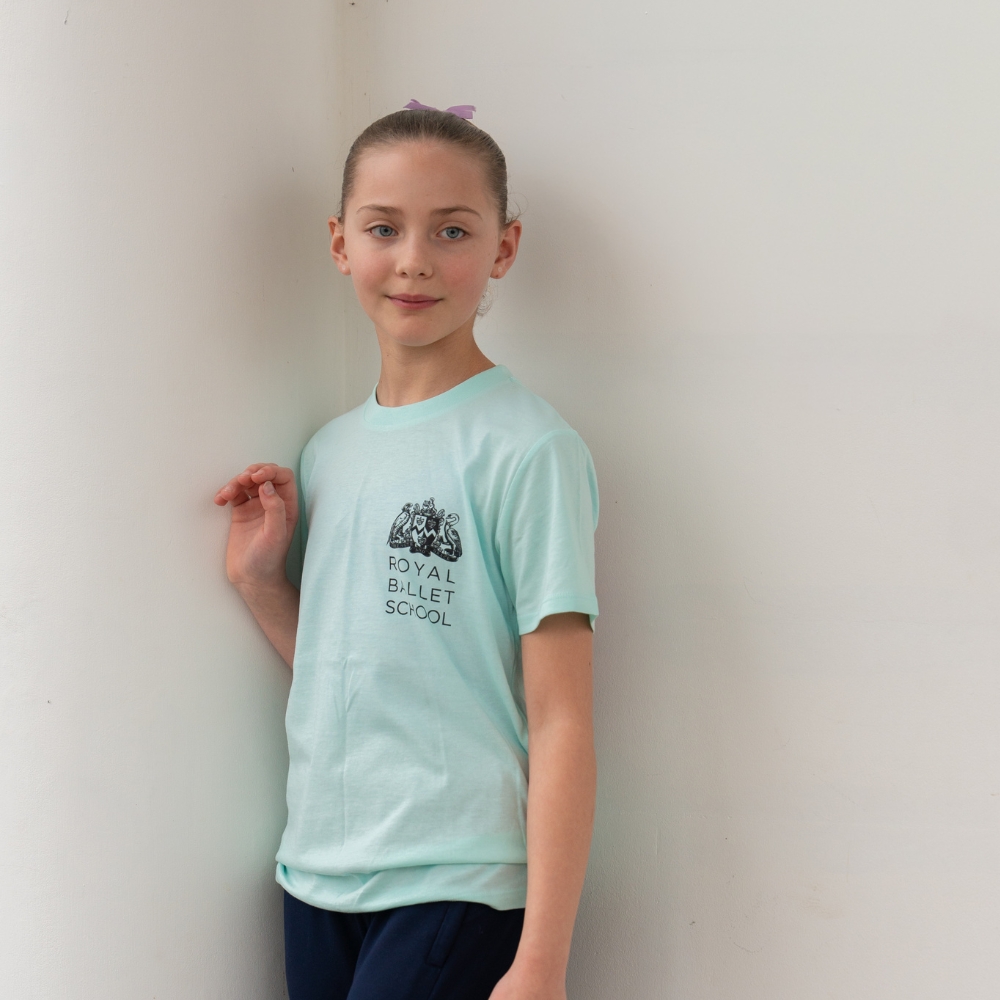 Fairy centenary children's t-shirt Product image of 'centenary performance children's t-shirt' in mint. Worn by a royal ballet school student at white lodge. A collection of merchandise in celebration of 100 years of the royal ballet school.