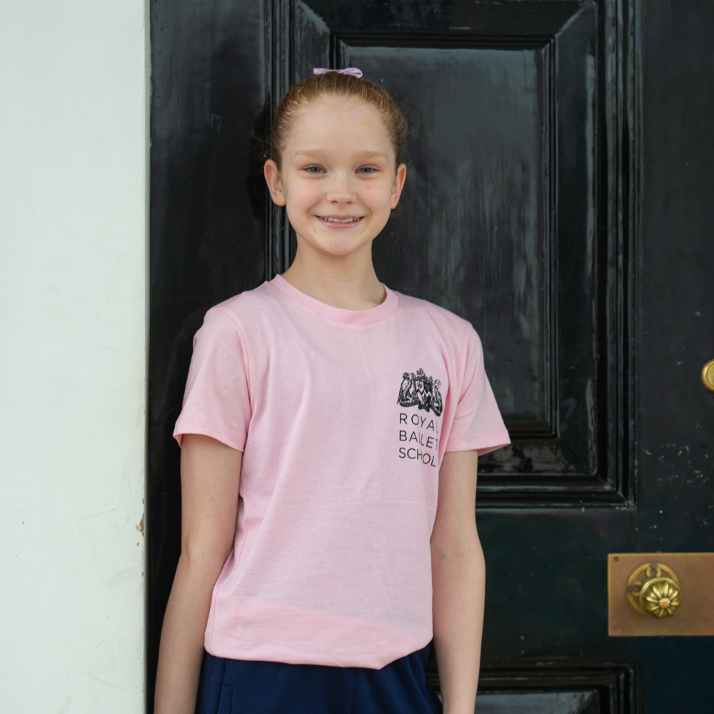 This is 100 years children's t-shirt pink Product image of 'this is 100 years children's t-shirt' in pink. Worn by a royal ballet school student at white lodge. A collection of merchandise in celebration of 100 years of the royal ballet school.