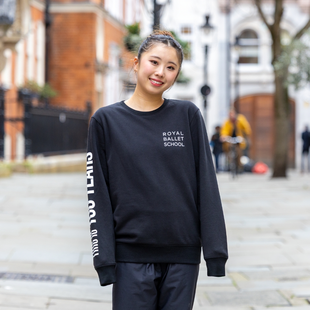 This is 100 years sweatshirt Product image of 'this is 100 years' sweatshirt in black. Worn by a royal ballet school student in upper school, covent garden. A collection of merchandise in celebration of 100 years of the royal ballet school.