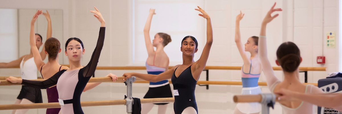 Intensive courses Ballet students attending the royal ballet school's summer intensive at white lodge. The dancers are at the barre.