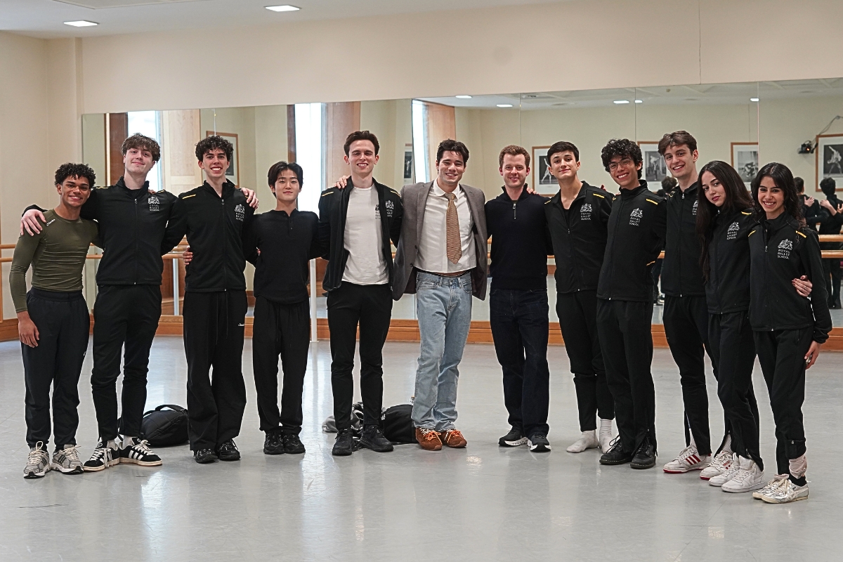Jovani furlan visit Jovani furlan stands with upper school students wearing school tracksuits in the studio after giving a creative artist talk